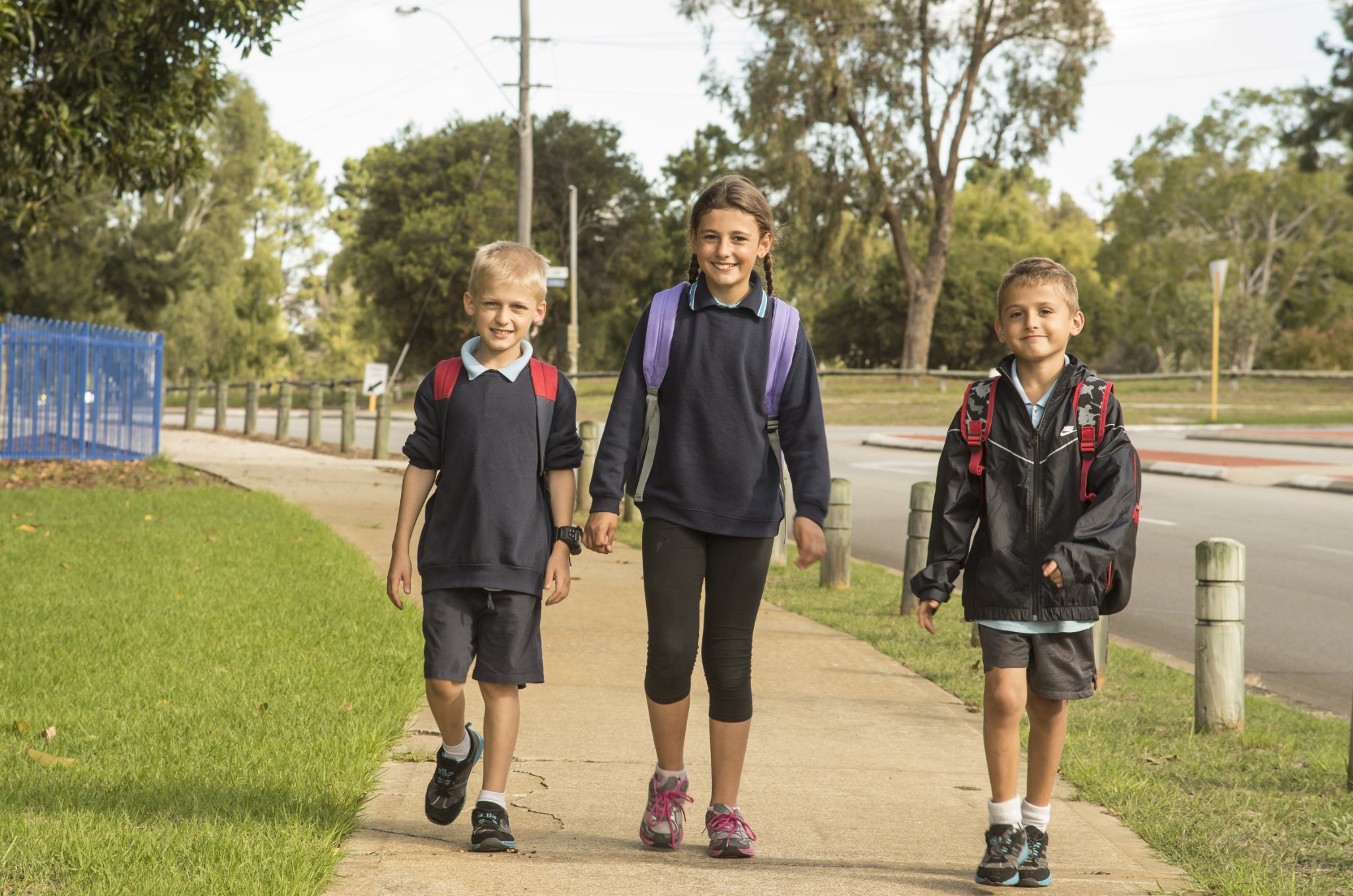 Three children walking to school